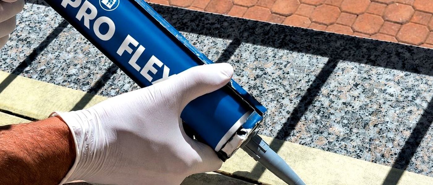 Sealing a joint on an outdoor pavement