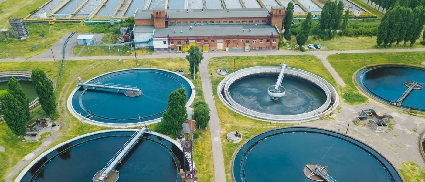 Circular sedimentation tanks at a wastewater treatment plant, aerial view